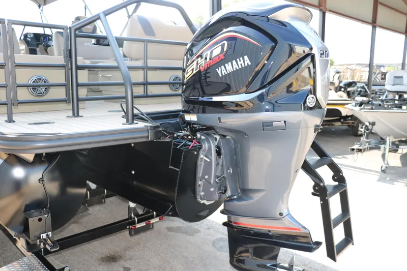 Slide: The Image of 2025 Sylvan L3 RLZ pontoon boat with Yamaha outboard motor. - 5