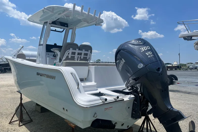 Slide: The Image of 2025 Sportsman Heritage 231 Center Console boat with Yamaha 300 V6 engine. - 2