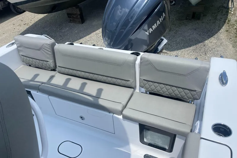 Slide: The Image of 2025 Sportsman Heritage 231 Center Console boat with Yamaha engine, featuring comfortable seating. - 9