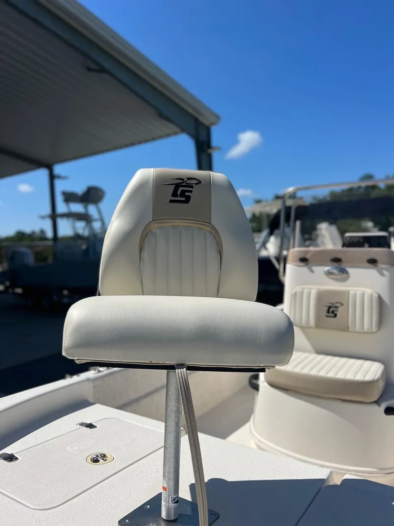 Slide: The Image of 2019 Carolina Skiff 18 JVX CC boat seat under clear blue sky. - 4