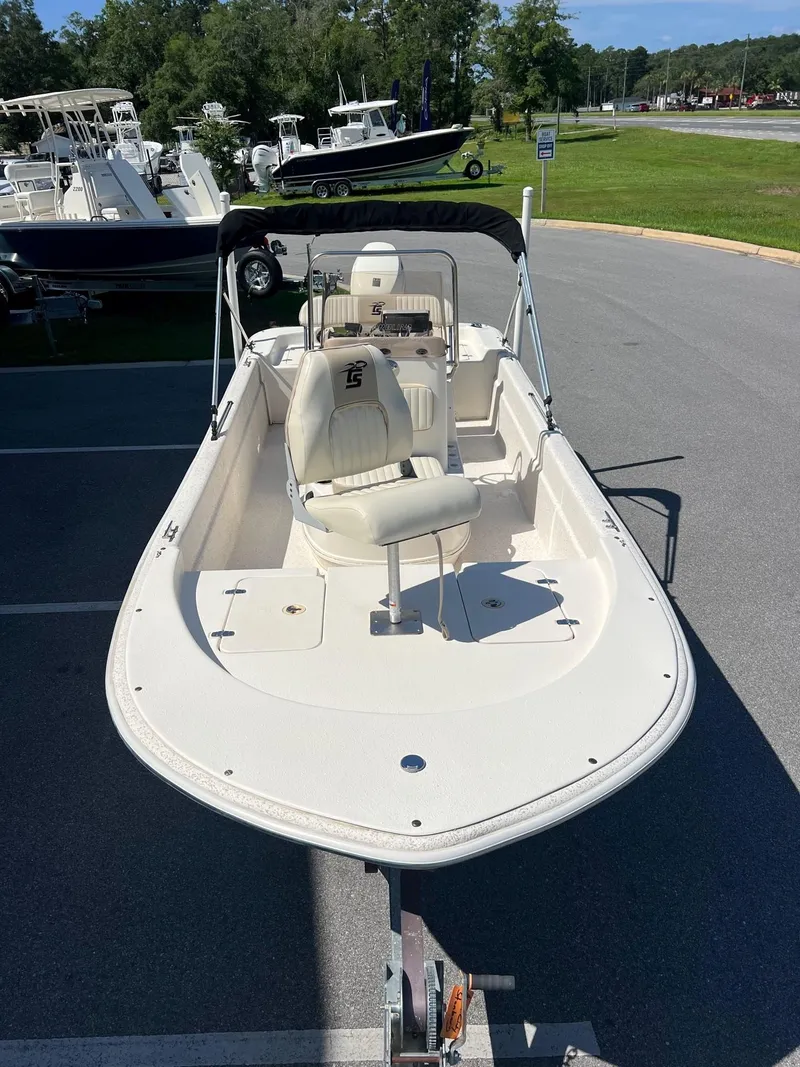 Slide: The Image of 2019 Carolina Skiff 18 JVX CC boat on trailer in parking lot. - 6