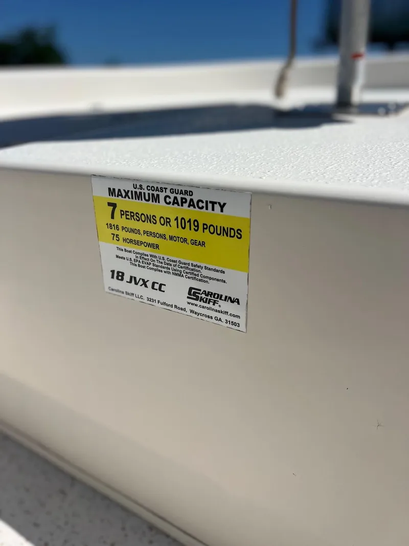 Slide: The Image of 2019 Carolina Skiff 18 JVX CC capacity label, 7 persons or 1019 pounds, 75 horsepower. - 7