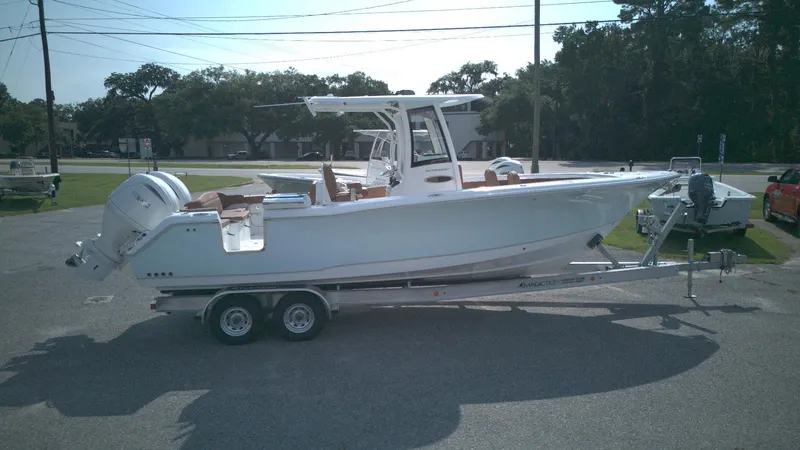 The Image of 2026 Sea Hunt Ultra 275 SE boat on trailer, parked outdoors. - 0