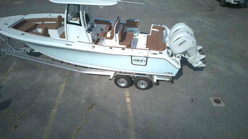 Slide: The Image of 2026 Sea Hunt Ultra 275 SE boat on trailer, featuring dual Yamaha engines. - 11