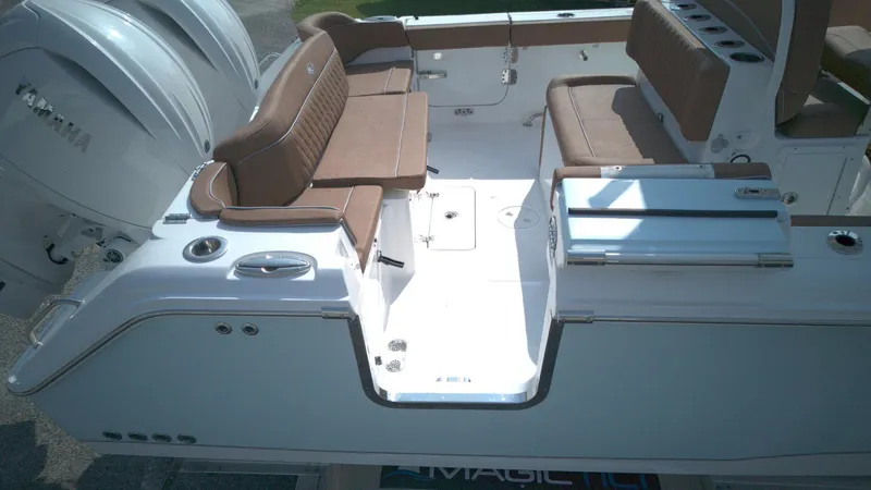 Slide: The Image of 2026 Sea Hunt Ultra 275 SE boat interior with seating and dual Yamaha engines. - 6