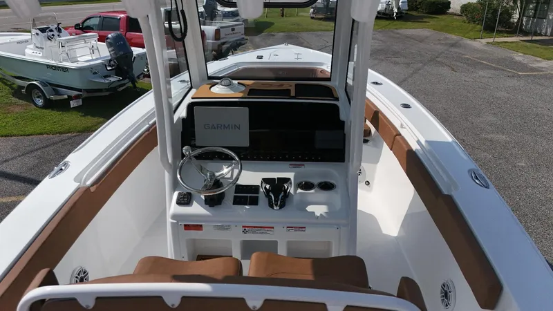 Slide: The Image of 2026 Sea Hunt Ultra 275 SE boat interior with Garmin navigation system. - 7