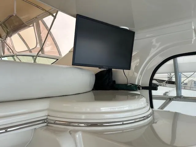 Slide: The Image of Interior of 2004 Carver 466 Motor Yacht with helm, seating, and table. - 10