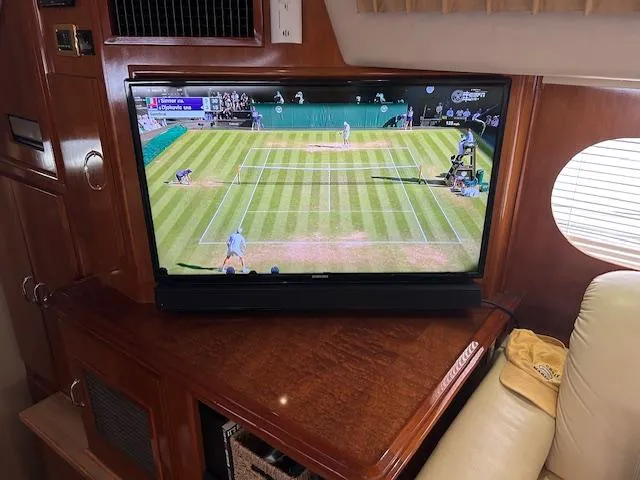 Slide: The Image of Two cushioned stools in a 2004 Carver 466 Motor Yacht interior. - 17