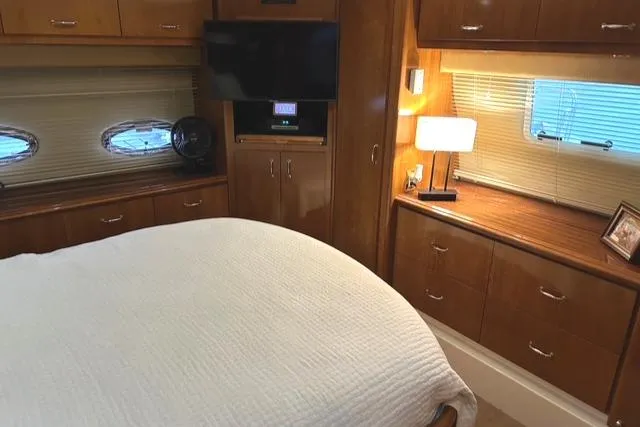 Slide: The Image of Interior of 2004 Carver 466 Motor Yacht with wooden flooring and cabinetry. - 19