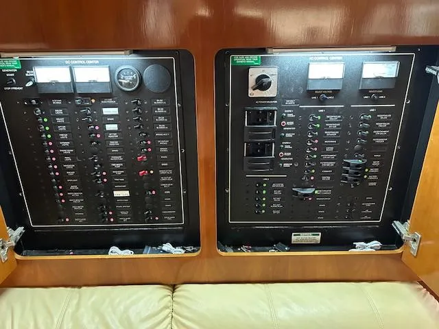Slide: The Image of Washer-dryer unit inside 2004 Carver 466 Motor Yacht, featuring control dials and buttons. - 28