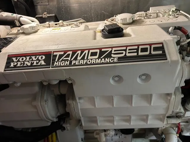 Slide: The Image of Coiled blue hose in a wooden cabinet on a 2004 Carver 466 Motor Yacht. - 30