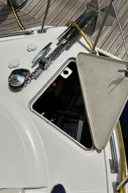 Slide: The Image of 2004 Carver 466 Motor Yacht under canopy, front view with windows and horns visible. - 36