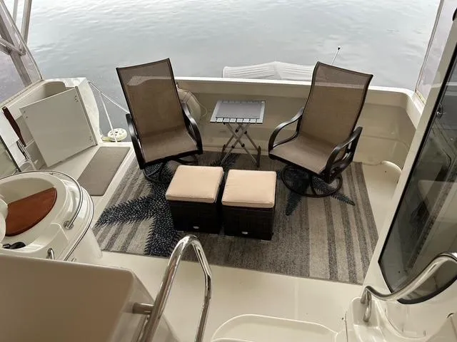 Slide: The Image of 2004 Carver 466 Motor Yacht deck with grill and seating, Port of St. Louis, MO. - 5