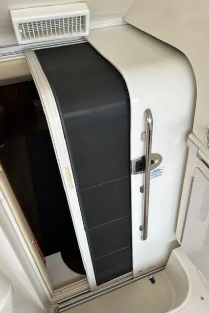 Slide: The Image of 2004 Carver 466 Motor Yacht interior with sink and seating area. - 7