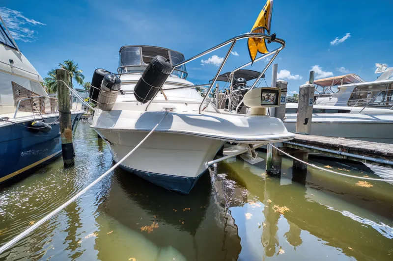Slide: The Image of 2003 Silverton 43 Motor Yacht on a serene river. - 1