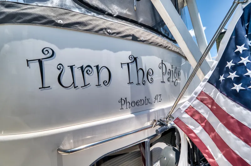 Slide: The Image of 2003 Silverton 43 Motor Yacht docked on a sunny day. - 11