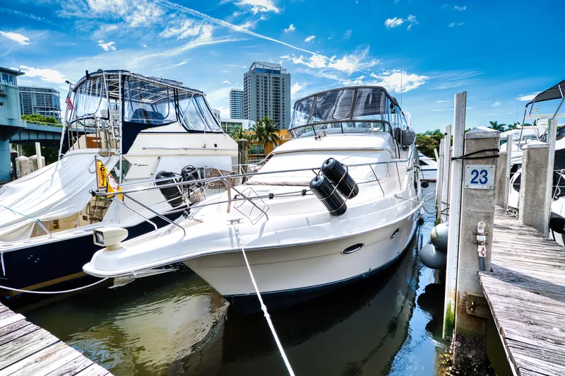 Slide: The Image of 2003 Silverton 43 Motor Yacht docked on a sunny day. - 14