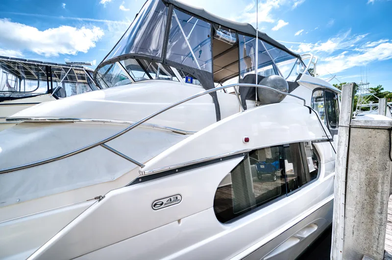 Slide: The Image of Interior of a 2003 Silverton 43 Motor Yacht with marina view. - 15