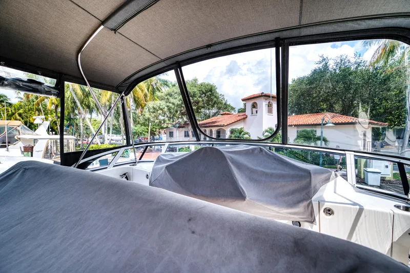Slide: The Image of Interior of a 2003 Silverton 43 Motor Yacht with gray covers. - 17