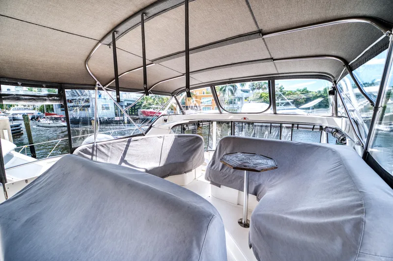 Slide: The Image of Interior view of 2003 Silverton 43 Motor Yacht helm with navigation system. - 19