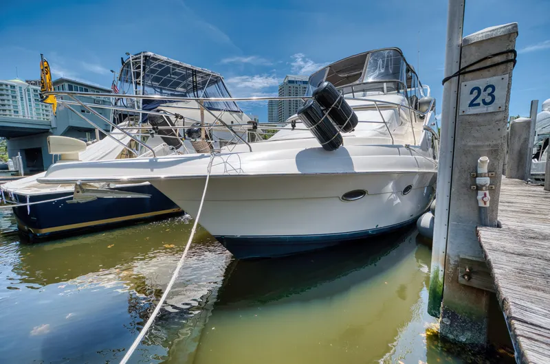 Slide: The Image of 2003 Silverton 43 Motor Yacht anchored on calm waters. - 2