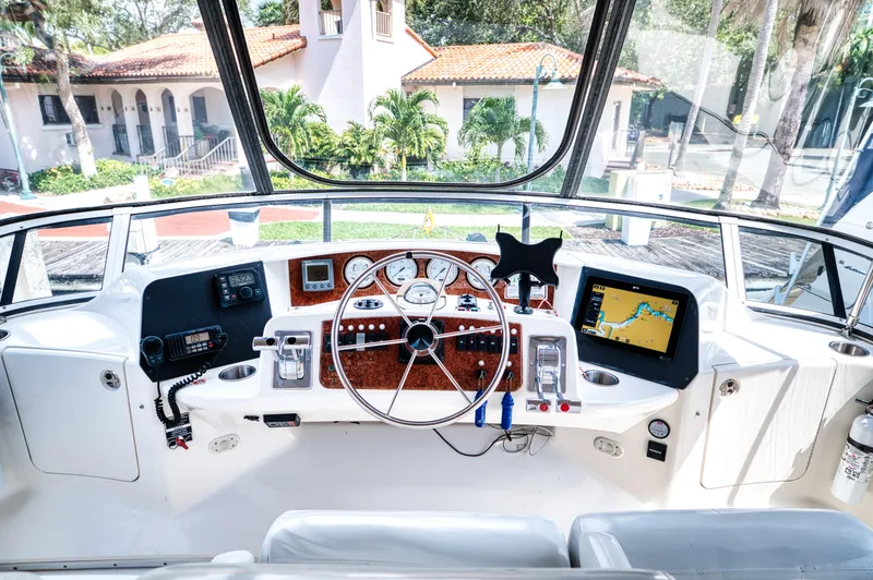 Slide: The Image of 2003 Silverton 43 Motor Yacht helm with navigation system. - 21
