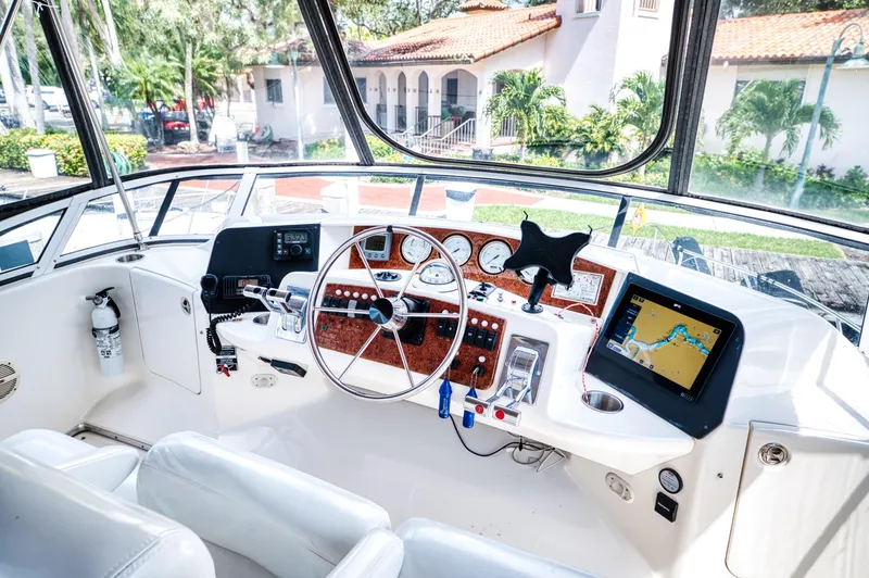 Slide: The Image of Interior view of 2003 Silverton 43 Motor Yacht helm. - 22