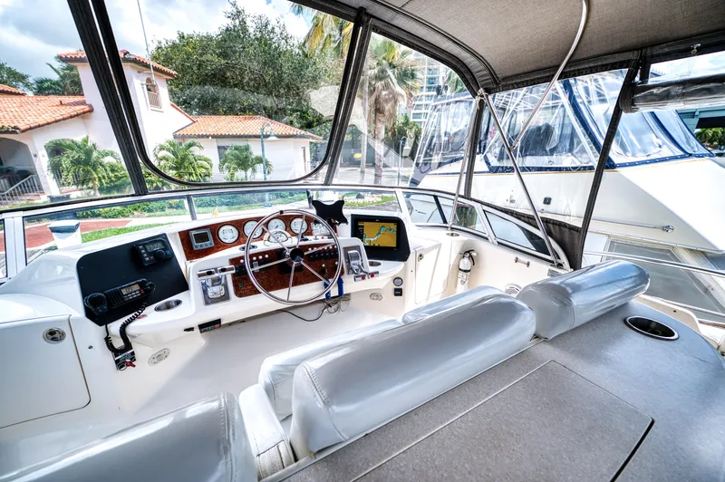 Slide: The Image of 2003 Silverton 43 Motor Yacht helm with navigation system. - 24