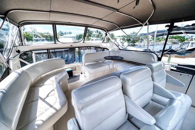 Slide: The Image of Interior of 2003 Silverton 43 Motor Yacht with white leather seating. - 26