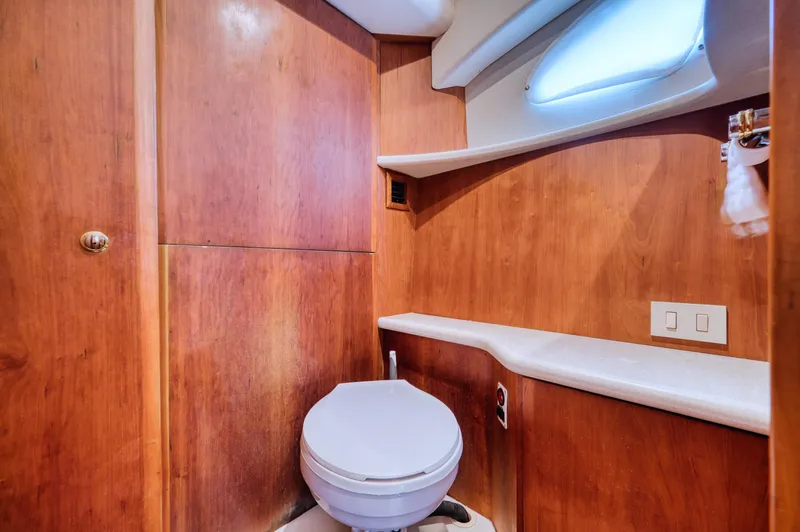 Slide: The Image of Interior of 2003 Silverton 43 Motor Yacht with wood paneling. - 34