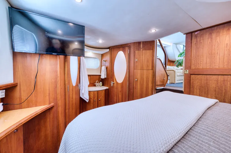 Slide: The Image of Interior of 2003 Silverton 43 Motor Yacht with wood paneling. - 36