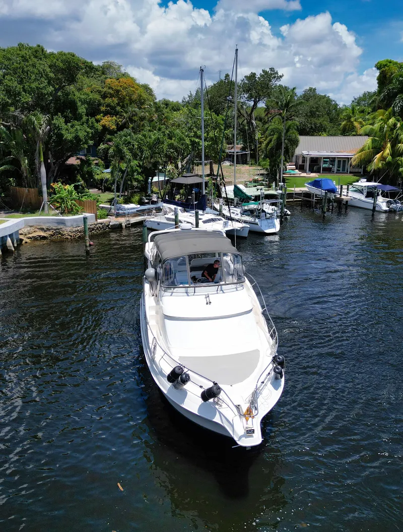 Slide: The Image of 2003 Silverton 43 Motor Yacht on a serene river. - 4