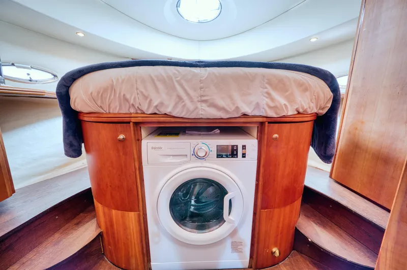 Slide: The Image of Silverton 43 Motor Yacht 2003 kitchen with wooden cabinets and appliances. - 42