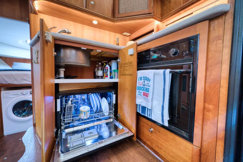 Slide: The Image of Interior of 2003 Silverton 43 Motor Yacht with cozy bed. - 46