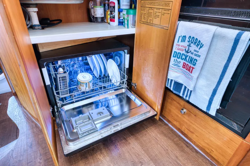 Slide: The Image of Interior of 2003 Silverton 43 Motor Yacht with washing machine. - 47