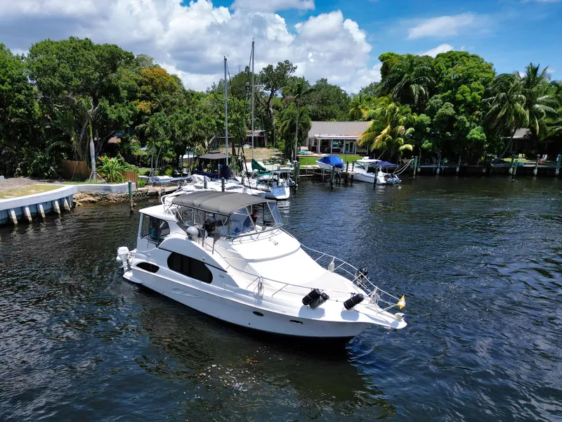 Slide: The Image of Aerial view of a 2003 Silverton 43 Motor Yacht on the water. - 5