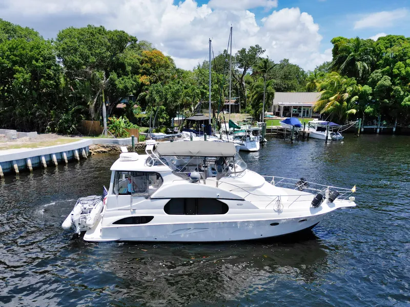 Slide: The Image of 2003 Silverton 43 Motor Yacht docked in sunny marina. - 6