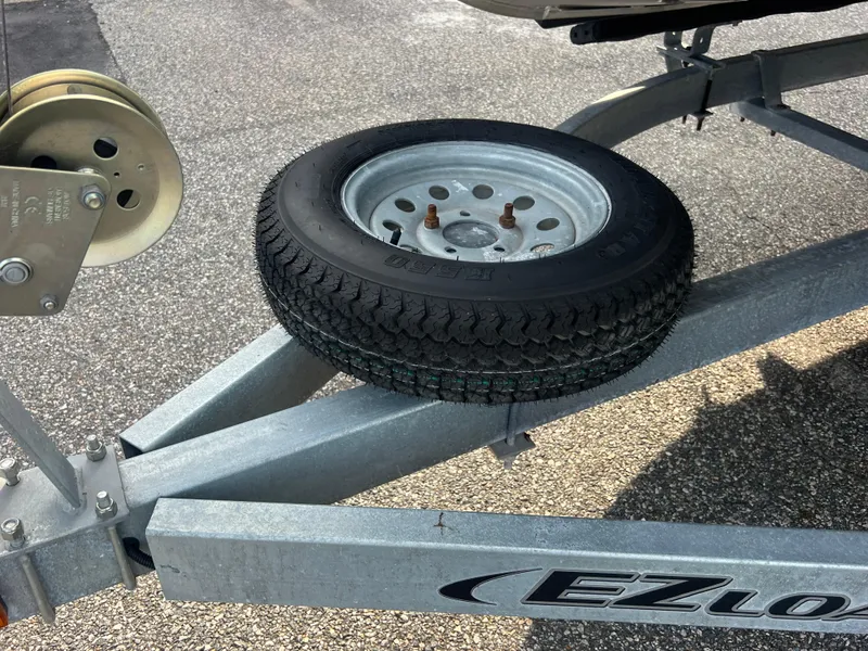 Slide: The Image of Trailer with spare tire for 2022 Bennington SX 20 Swingback boat. - 10