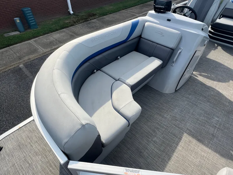 Slide: The Image of 2022 Bennington SX 20 Swingback boat interior with gray seating and modern design. - 12
