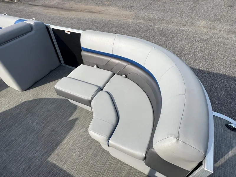 Slide: The Image of 2022 Bennington SX 20 Swingback boat with gray and blue cushioned seating. - 13