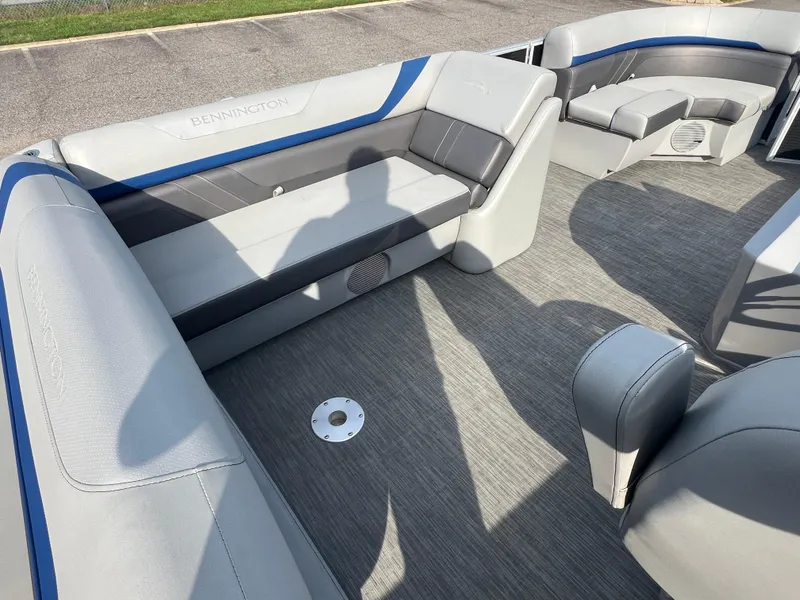 Slide: The Image of 2022 Bennington SX 20 Swingback interior with gray seating and carpeted flooring. - 25