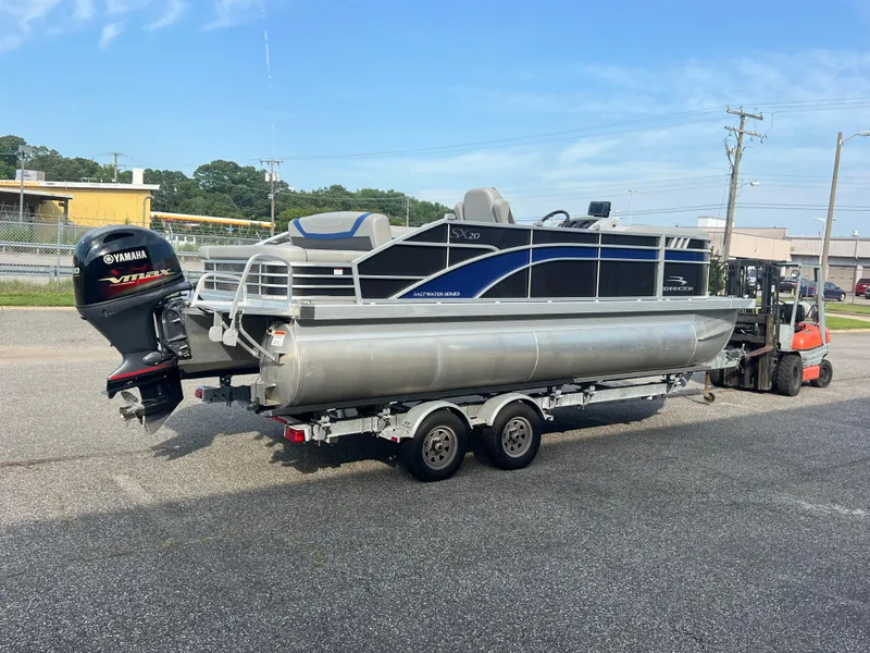 Slide: The Image of 2022 Bennington SX 20 Swingback pontoon boat on trailer with Yamaha VMAX engine. - 3