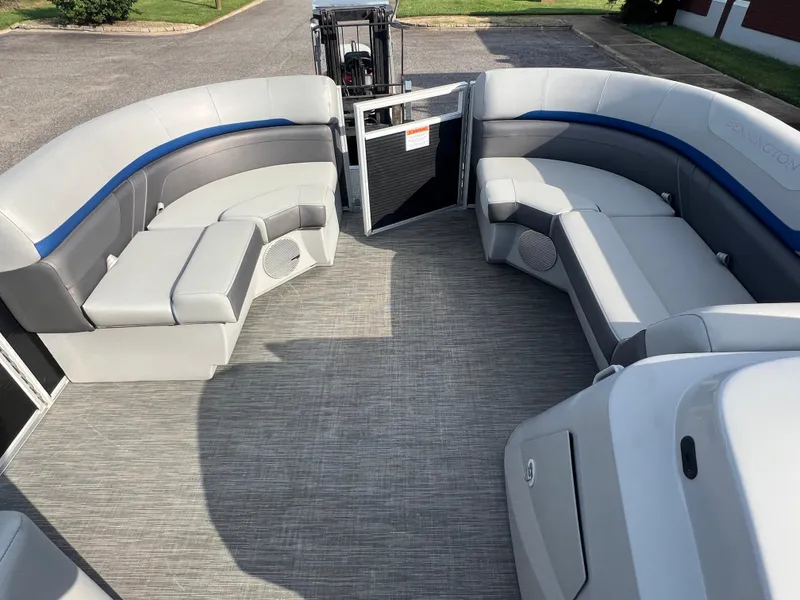 Slide: The Image of 2022 Bennington SX 20 Swingback pontoon boat interior with gray seating and open gate. - 32