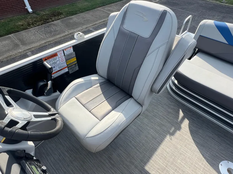 Slide: The Image of Captain's chair on 2022 Bennington SX 20 Swingback pontoon boat, featuring sleek design and controls. - 36