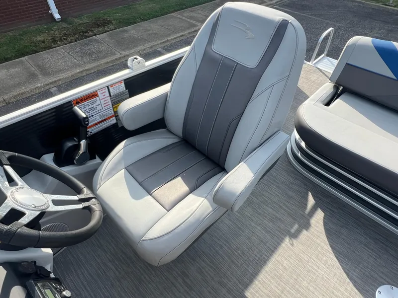 Slide: The Image of Captain's chair on 2022 Bennington SX 20 Swingback pontoon boat, featuring sleek design and controls. - 37