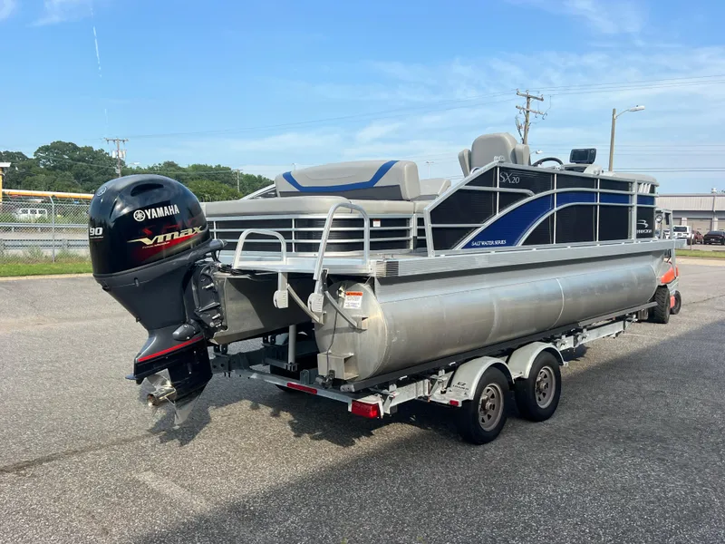 Slide: The Image of 2022 Bennington SX 20 Swingback pontoon boat with Yamaha VMAX engine on trailer. - 4