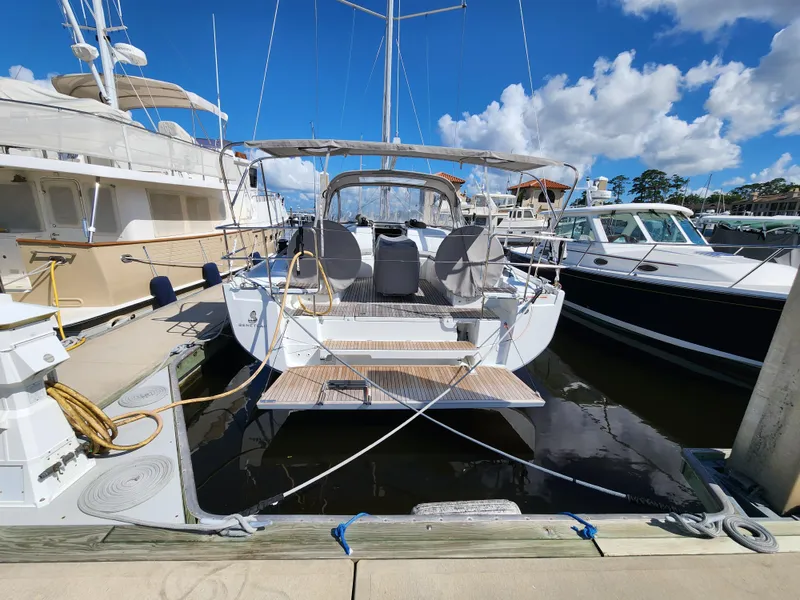 Slide: The Image of 2022 Beneteau Oceanis 40.1 yacht docked at marina under blue sky. - 10