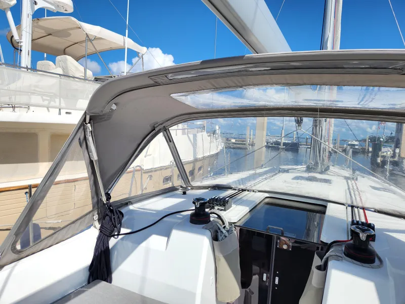 Slide: The Image of Beneteau Oceanis 40.1 sailboat cockpit, 2022 model, docked at marina under clear blue sky. - 17