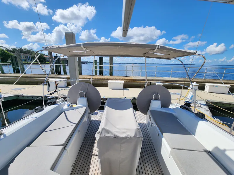 Slide: The Image of Beneteau Oceanis 40.1 yacht deck, 2022 model, docked with clear blue sky and water view. - 19