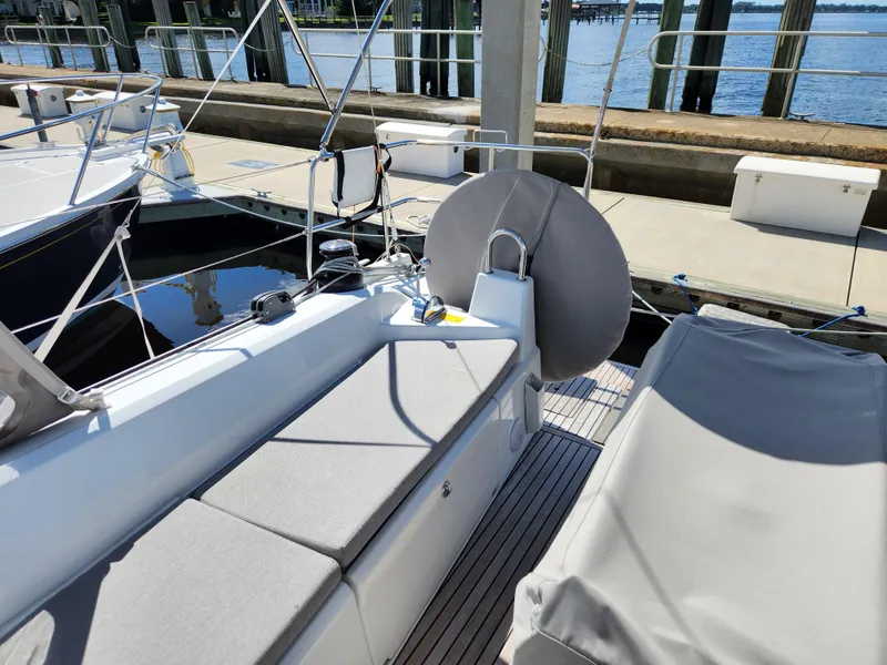 Slide: The Image of Beneteau Oceanis 40.1 yacht deck, 2022 model, docked at marina with seating area. - 20